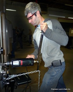 safe technician drilling open safe (safe opening)